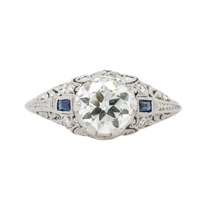 A Beautiful Art Deco Bombe Style Platinum, Diamond and Synthetic Sapphire Ring